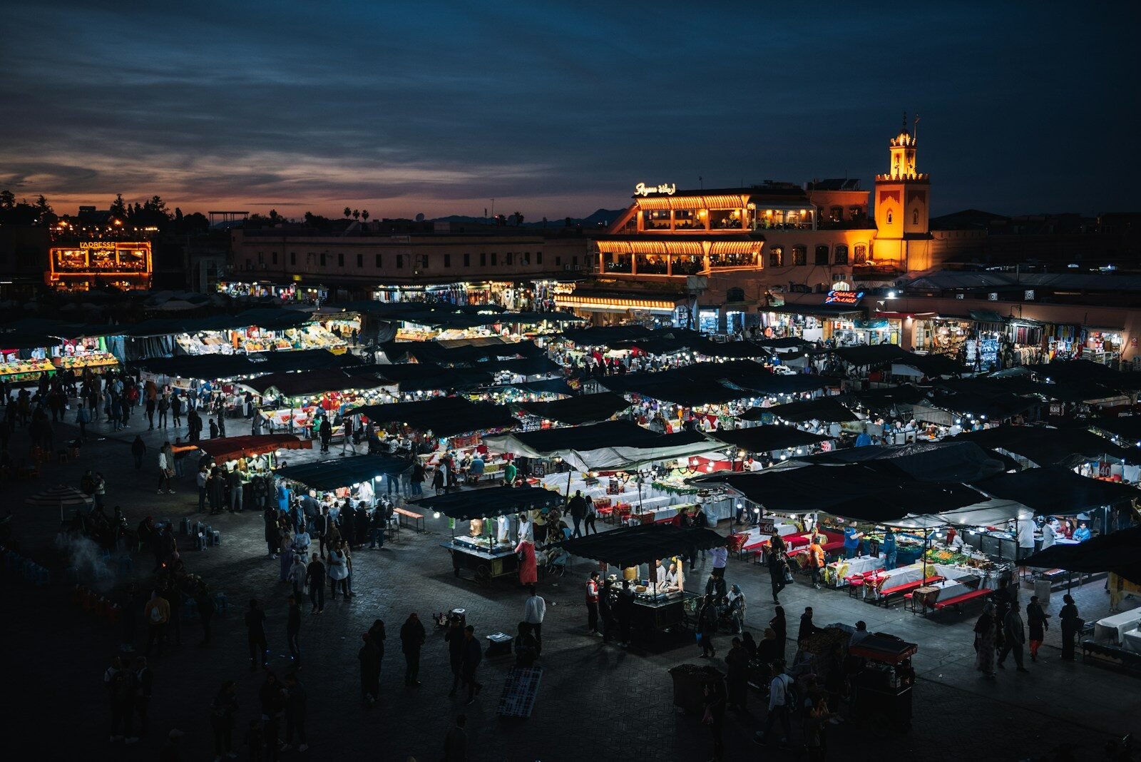 Marrakech by night — Jemaa el-Fna square lit up at sunset